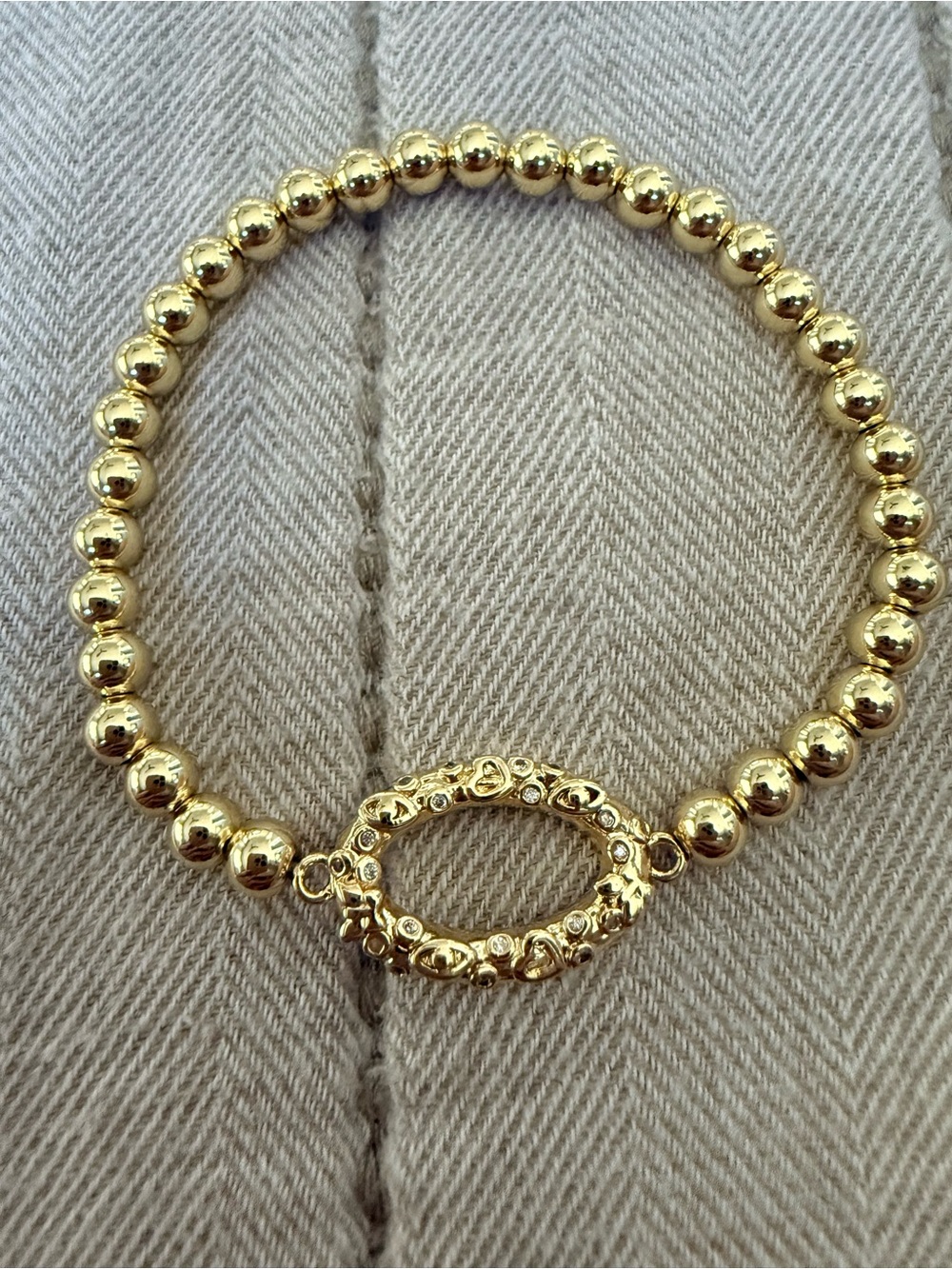 Gold Beaded Stretch Bracelet with Ornate Oval Accent